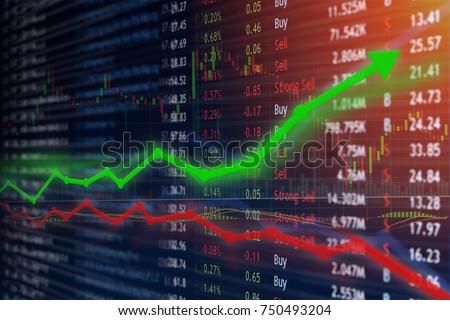 Investing and stock market concept gain and profits with faded candlestick charts. Royalty-Free Stock Photo #750493204