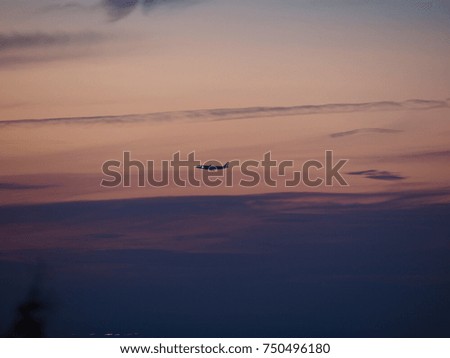 A plane landing in Montreal airport at the sunset