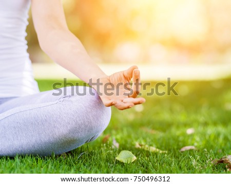 Woman meditating in the park