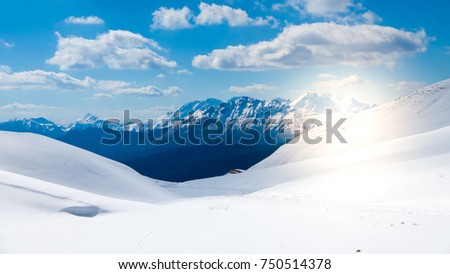 Mountain range seen from the top of the glacier, sunflare effect