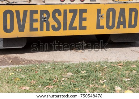 Oversize load sign on the back of a semi truck