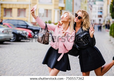 two women friends making self portrait