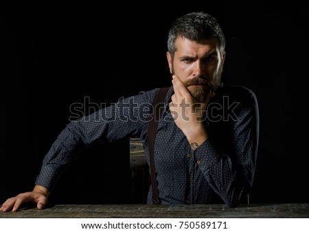 Fashion and beauty. Business and success. Businessman or ceo at table. Man in formal outfit isolated on black background. Manager with beard on serious face., copy space