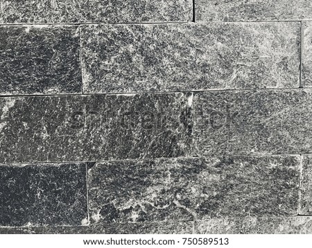 flat square grey natural color granite rocks as a wall in full frame