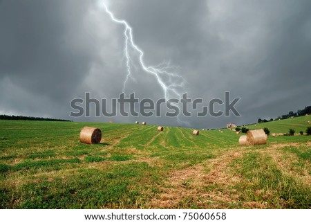 raining sky over the field Royalty-Free Stock Photo #75060658