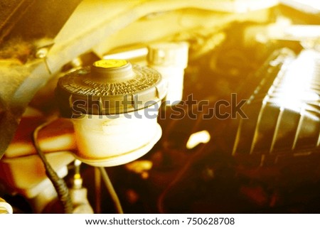 bowl of brake fluid and clutch oil Close to the engine.