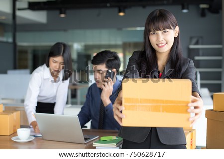 Young Asian Woman holding box with smiling, Young Owner Woman Start up for Business Online, SME, Delivery Project, Woman with Online Business or SME Concept.