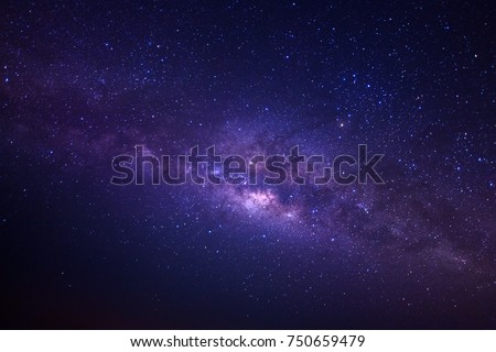 Milky way galaxy with stars and space dust in the universe, Long exposure photograph, with grain. Royalty-Free Stock Photo #750659479