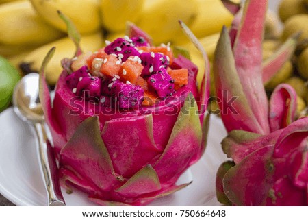 Fresh tropical fruit salad in dragon fruit skin - healthy breakfast, weight loss concept. Thailand, close up