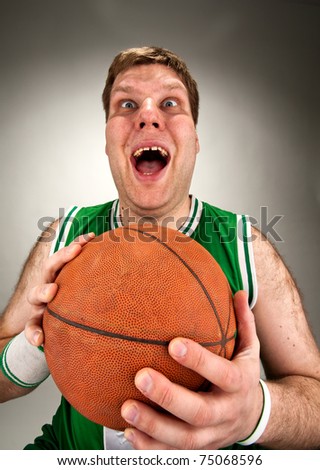 Portrait of bizarre basketball player with ball