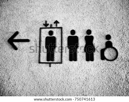 Close up toilet black icon on concrete wall for man,woman and disabled