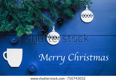 New year's background on a blue desk decorated with toys, presents, Christmas tree, candles. Bright colored background symbolizes the new year celebration. Great useful template to wright words down.