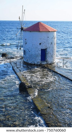 Photo from iconic picturesque windmill at sea  in Leros island, Dodecanese, Greece                     