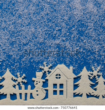 Christmas card on blue background with decorative snow,snowflake and winter theme pattern. Place for text.