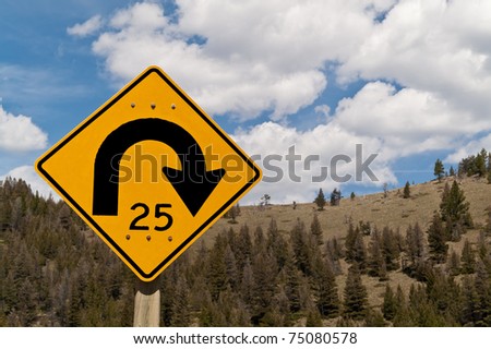 Road sign to warn of twenty-five mile per hour curve ahead