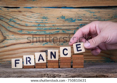 France. Wooden letters on the office desk, informative and communication background