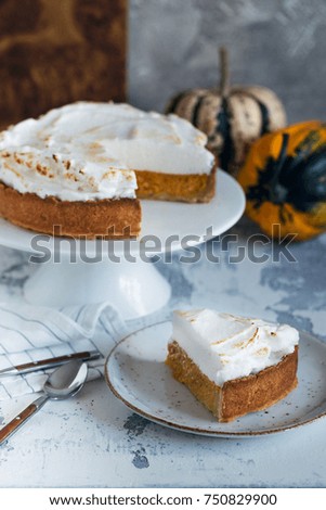 Pumpkin pie decorated with Italian meringue – vertical composition
