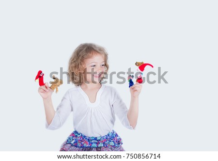 five year old girl with finger Puppets 