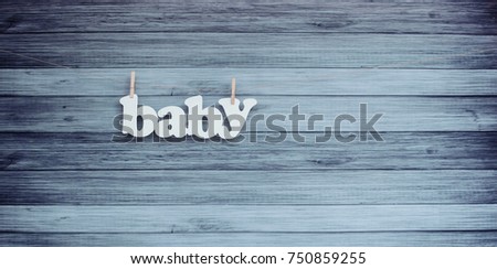 Blue wooden background with inscription baby