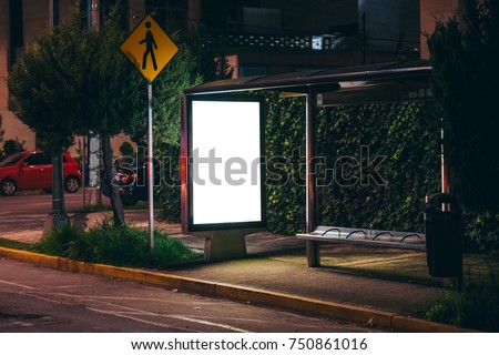 White isolated backlit ad space at a bus stop on the street Royalty-Free Stock Photo #750861016