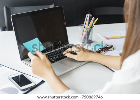 Businesswoman using laptop computer at the office