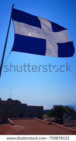 Photo of Greek flag in iconic picturesque castle of Panteli of Leros island with unique views to the island, Dodecanese, Greece           