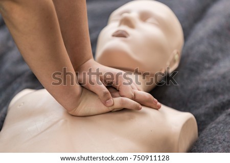 Cpr training outdoors. Reanimation procedure on CPR doll Royalty-Free Stock Photo #750911128