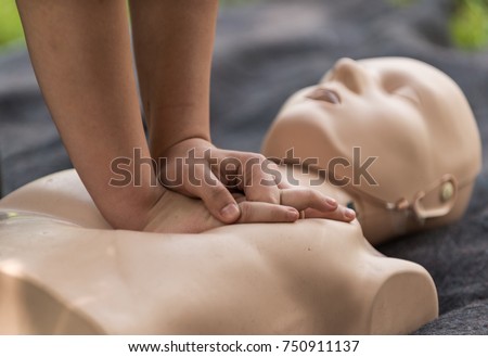 Cpr training outdoors. Reanimation procedure on CPR doll Royalty-Free Stock Photo #750911137