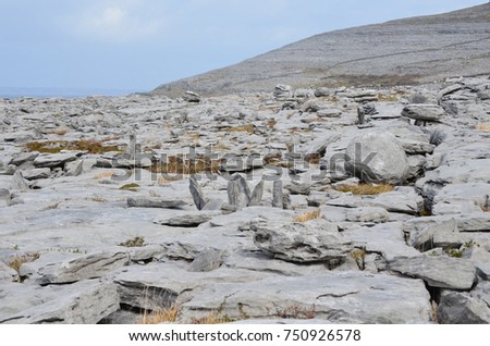 Beautiful landscape in Burren Ireland with gray rocks and blue skies 
