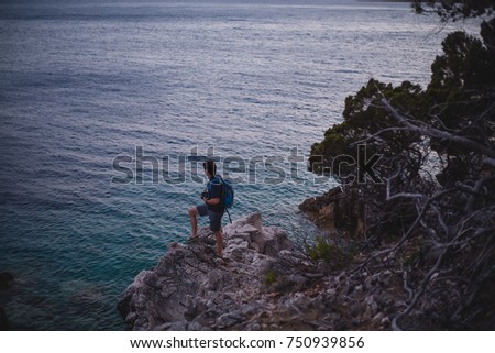 Man takes pictures of the landscapes at sunset,amazing landscapes background,natural colors,beach in evening,seascapes,sunrise,beautiful nature,water,atmosphere,scenic,perfect,island,lifestyle