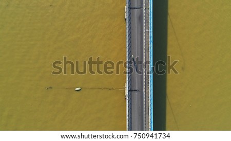 Aerial view. A motorcyclist using bridge.