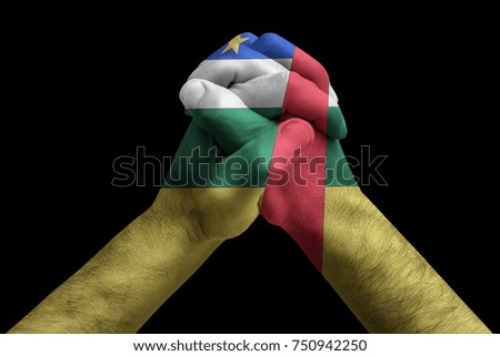 Fist painted in colors of Central african rep flag, fist flag, country of Central african rep