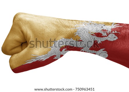 Fist painted in colors of Bhutan flag, fist flag, country of Bhutan