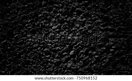 Rough dark  plaster wall with a bright spot background for designers, Decorative black structural cement wall, black stone plaster concrete wall, Black background with spotlight, black texture
