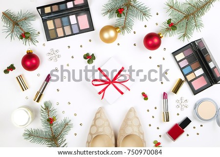 Beauty make up cosmetic set with christmas decoration and woman's shoes flat lay on white background