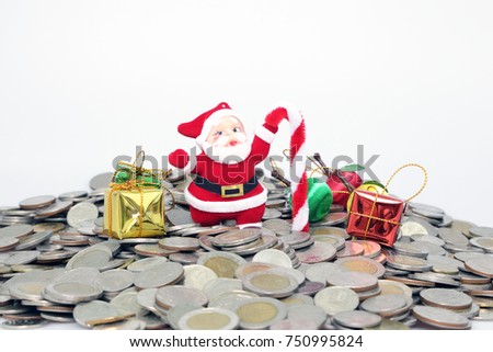 Santa claus with staff and gift box and apple on money coins white background, Merry christmas and happy new year concept.