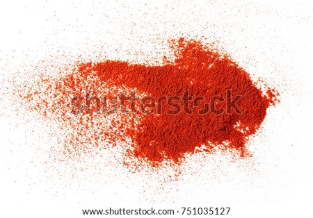 Pile of red paprika powder isolated on white background, top view Royalty-Free Stock Photo #751035127
