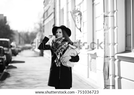 Black and white photo of a young girl on walk