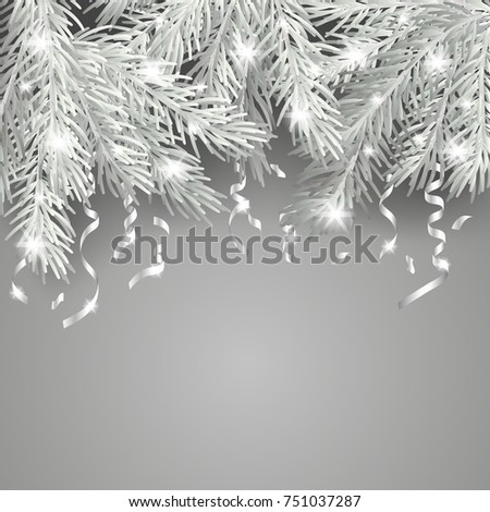 White and shiny Christmas tree branch with silver serpentine on a gray background. Merry Christmas and Happy New Year background for the poster, flyer, banner and cover of the calendar 2018.