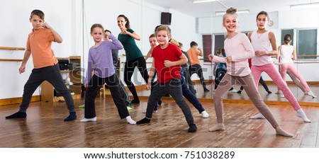Little children studying contemp dance in studio Royalty-Free Stock Photo #751038289
