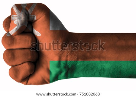 Fist painted in colors of Oman flag, fist flag, country of Oman