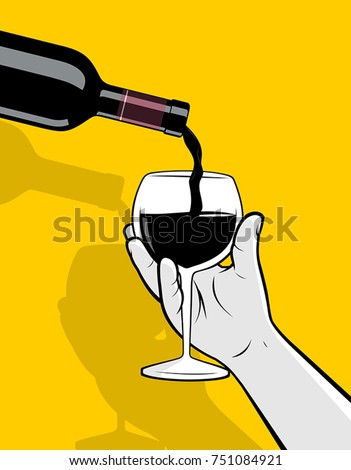 Bottle pouring red wine into glass