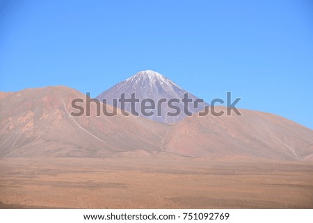 Snow capped volcano in the Chilean Andes. Royalty-Free Stock Photo #751092769