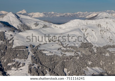 Winter mountain landscape with ski slopes, trees covered by snow, Kitzbuhel, Tyrol, Austria