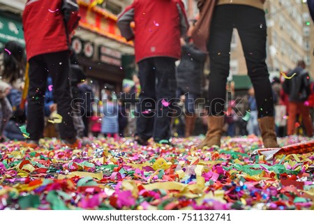 Confetti lines the streets after the Chinese New Year celebration in New York's Chinatown. 