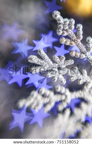 Christmas snowflake on the lights background