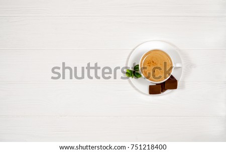 coffee with chocolate on a wooden background