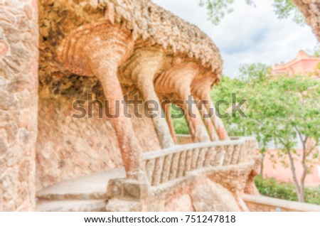 Defocused background of colonnaded viaduct, Park Guell, Barcelona, Catalonia, Spain. Intentionally blurred post production for bokeh effect