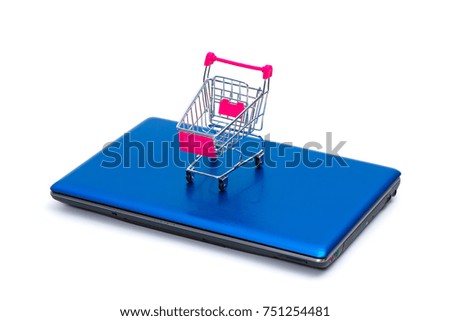 Shopping cart or supermarket trolley with laptop notebook isolated on white background and copy space, e-commerce and online shopping concept.