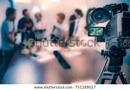 Video camera taking live video streaming at people working background Royalty-Free Stock Photo #751288027
